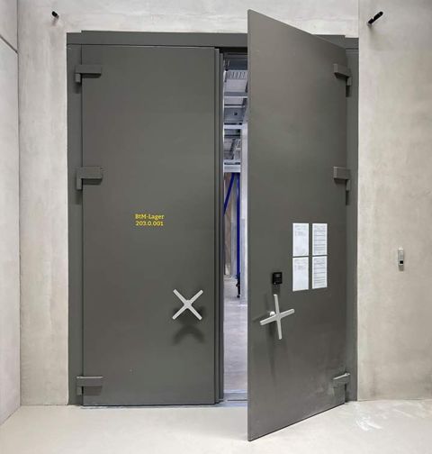 Olive-green double-leafed vault door