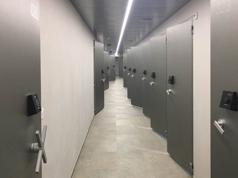 Corridor with several open security doors left and right